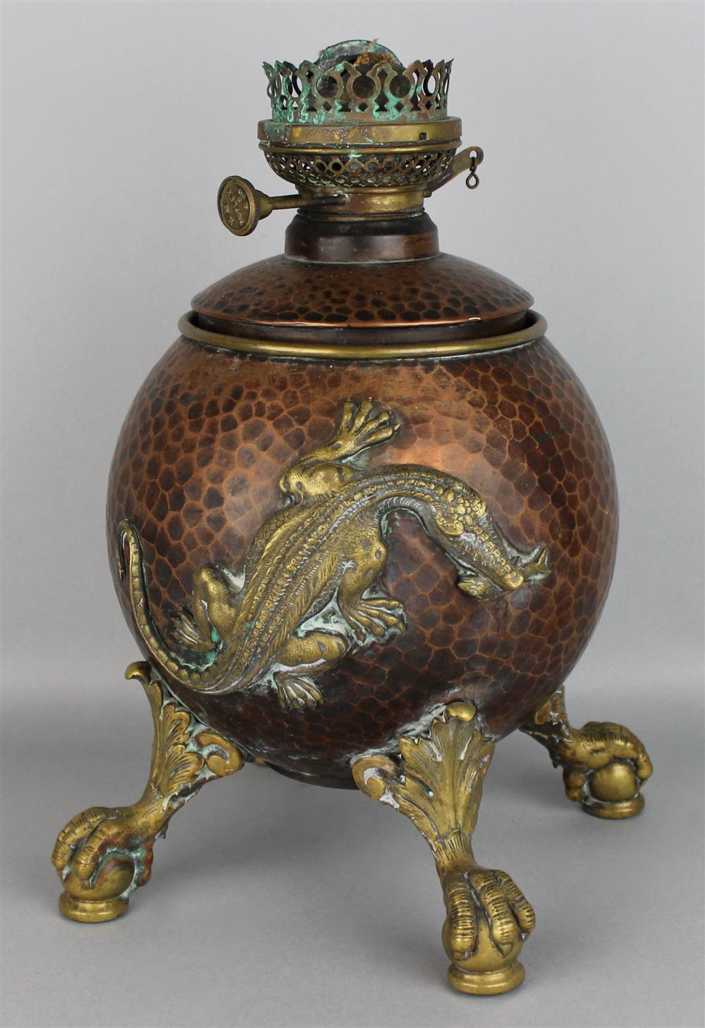 Appraisal: JAPONISME MIXED METAL OIL LAMP the hammered copper-colored body applied