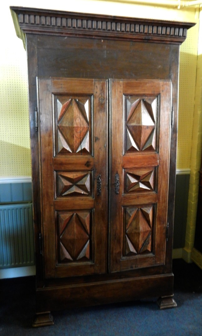 Appraisal: An early thC French chestnut armoire the top with a