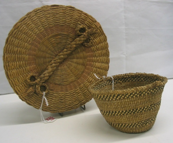 Appraisal: TWO HAND WOVEN NORTHWEST INDIAN BASKETS the first of cedar