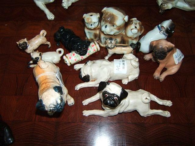 Appraisal: A Basil Matthews pottery pug dog two Meissen pug dogs