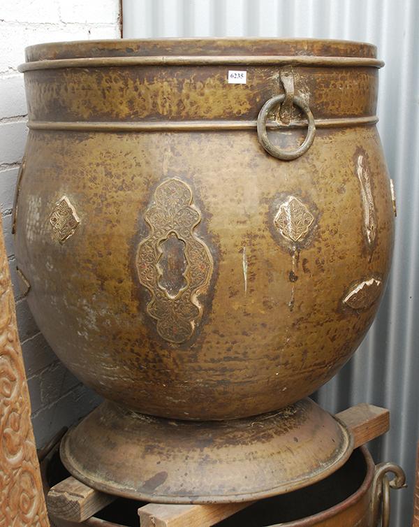 Appraisal: A SUBSTANTIAL INDIAN BEATEN COPPER AND BRASS GRAIN POTthe deep