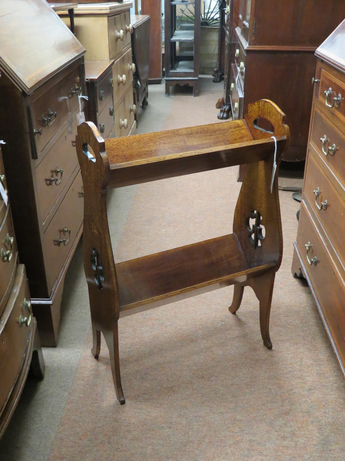 Appraisal: An Edwardian inlaid mahogany book-trough two-tiered form with carrying handles