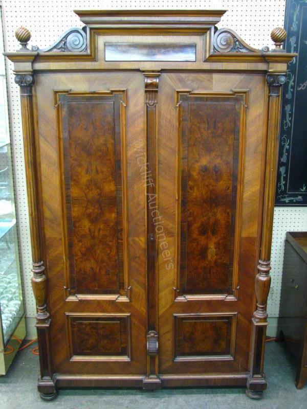 Appraisal: An Austrian Victorian armoire with carved doors and trim raised