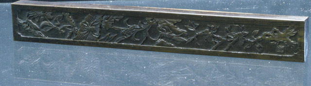 Appraisal: A scroll rest with carved decoration of various insects midst