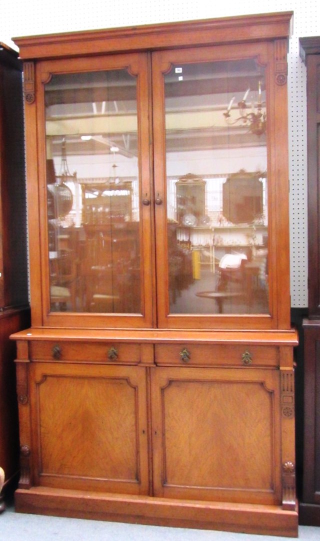 Appraisal: A Victorian oak bookcase cabinet with pair of glazed doors