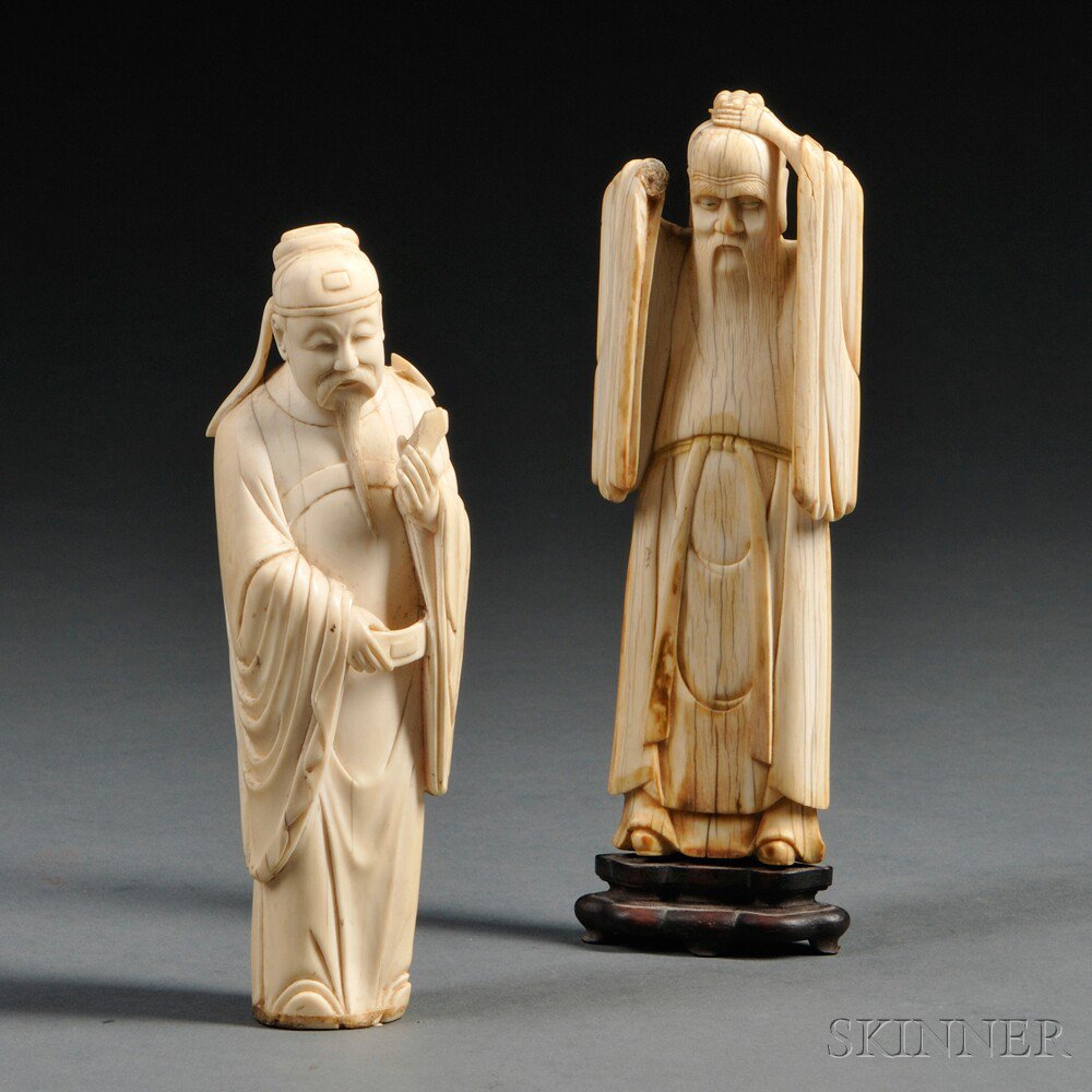 Appraisal: Two Carved Ivory Standing Figures China th century a Ming