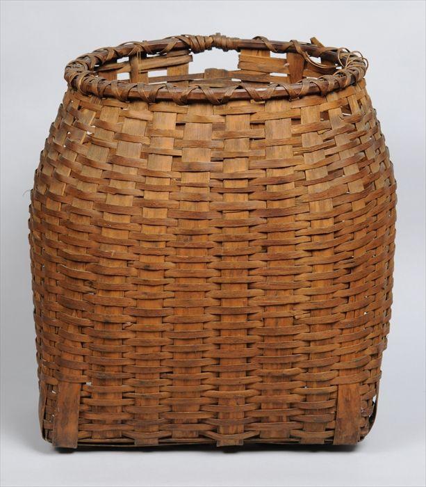 Appraisal: FIVE BASKETS Including a splint flat-back carrier a basket of