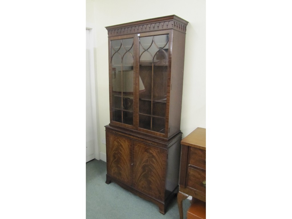 Appraisal: Reproduction bookcase on cupboard base