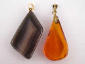 Appraisal: A silver gilt mounted amber pendant approx cm and a