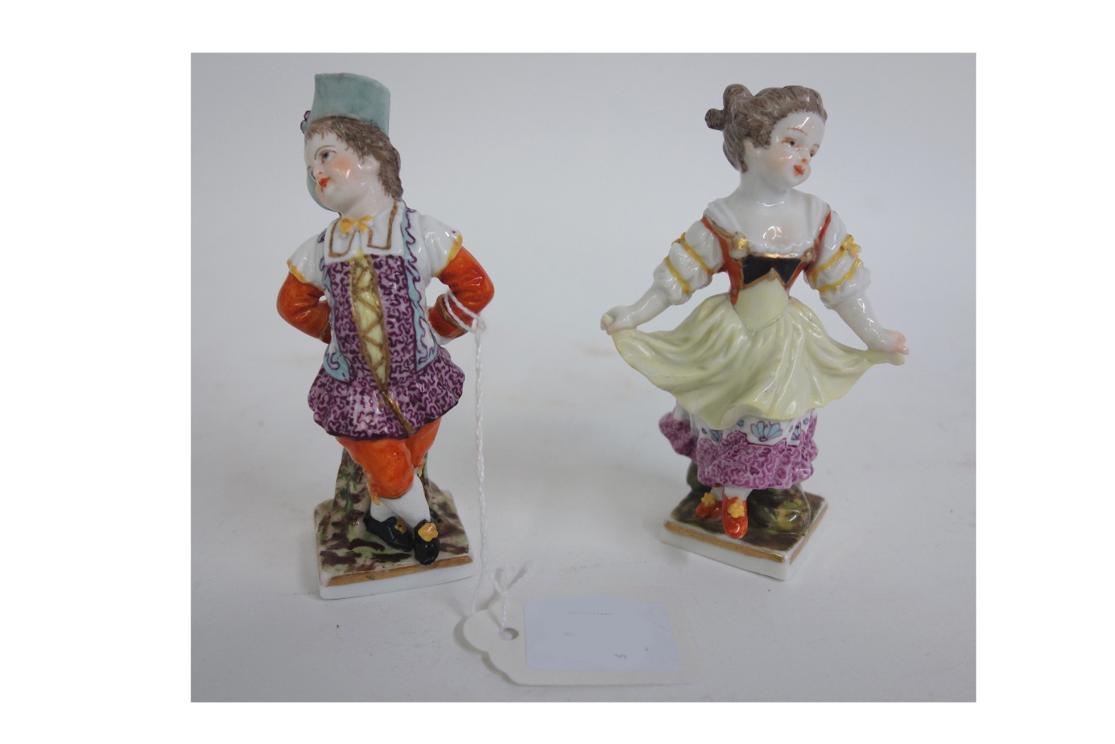 Appraisal: A pair of Dresden porcelain figures decorated in the Helena