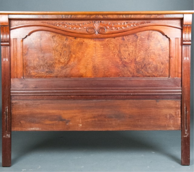 Appraisal: Carved Walnut Veneer Headboard Carved floral crest with column sides