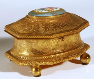 Appraisal: AN ORMOLU JEWELRY CASKET WITH SEVRES TYPE PORCELAIN Circa early