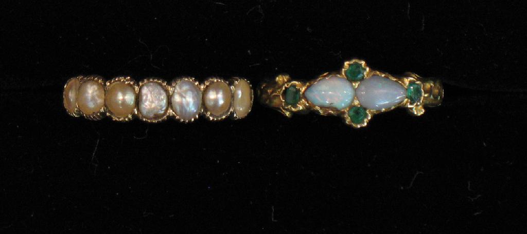 Appraisal: A VICTORIAN OPAL AND EMERALD DRESS RING the two central