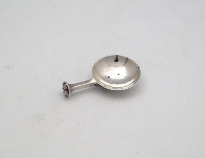 Appraisal: An arts and crafts silver caddy spoon by A E