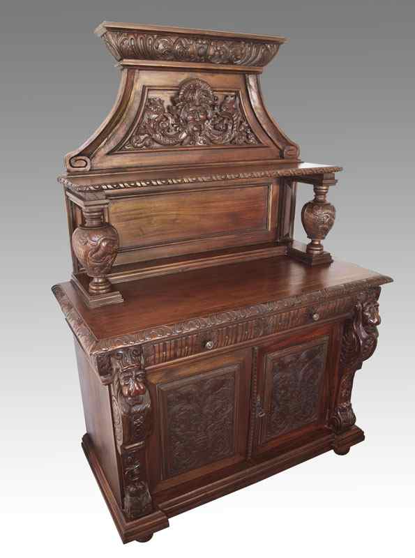 Appraisal: ORNATE CARVED MAHOGANY SIDEBOARD th century production heavily carved with