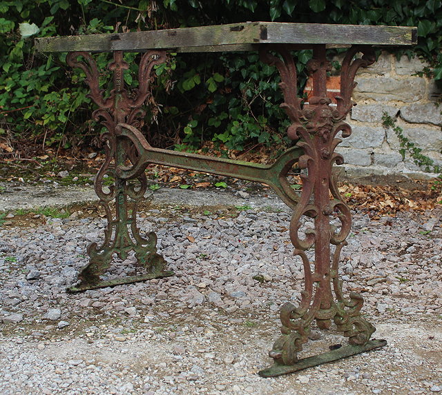 Appraisal: A MARBLE TOPPED RECTANGULAR GARDEN TABLE the cast iron base