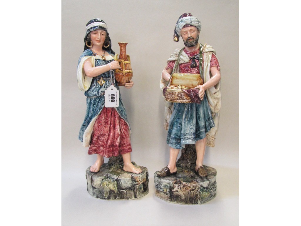 Appraisal: Pair of continental figures he selling fruit she oil