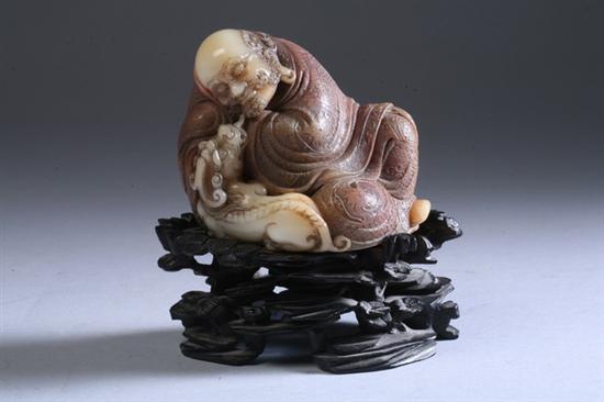 Appraisal: FINE CHINESE SOAPSTONE FIGURE OF LOHAN AND QILIN th century