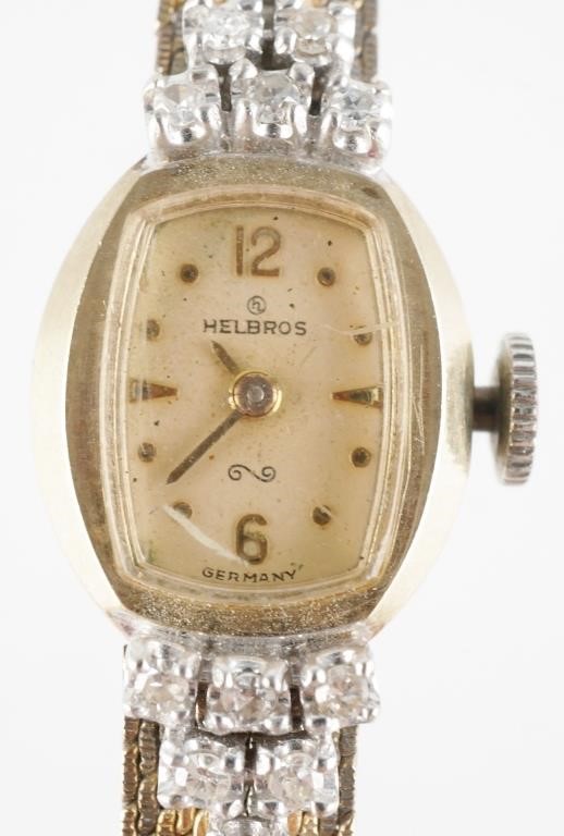 Appraisal: Ladies Helbros K yellow gold and diamond wristwatch Band is