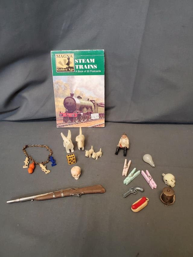 Appraisal: A miscellaneous grouping including several small vintage Cracker Jack Toys