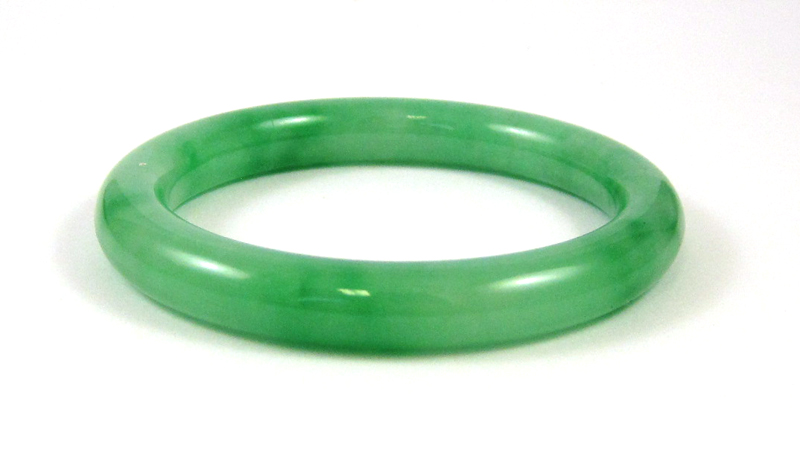 Appraisal: ROUND GREEN JADE BANGLE weighing grams and measuring inches in