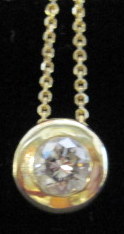 Appraisal: karat yellow gold diamond pendant necklaceBezel set round cut diamond