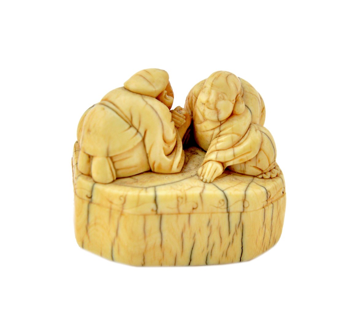 Appraisal: A Japanese ivory netsuke of Ebisu and Hotei arm wrestling