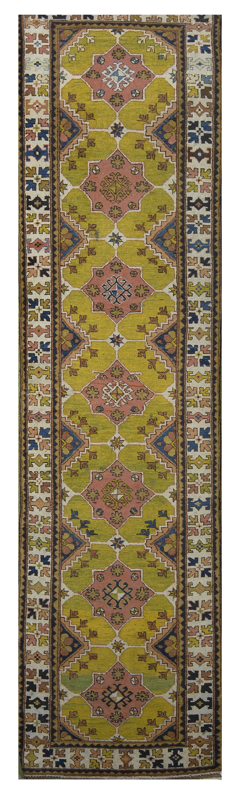 Appraisal: ORIENTAL RUG CAUCASIAN-DESIGN RUNNER ' x ' Seven pink geometric