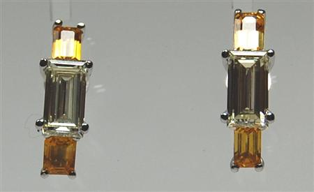 Appraisal: A modern pair of yellow sapphire and diamond earrings each