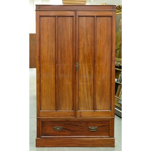 Appraisal: A mahogany wardrobe late th c enclosed by a pair