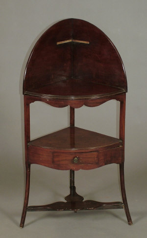 Appraisal: A mahogany three tier corner washstand early th century and