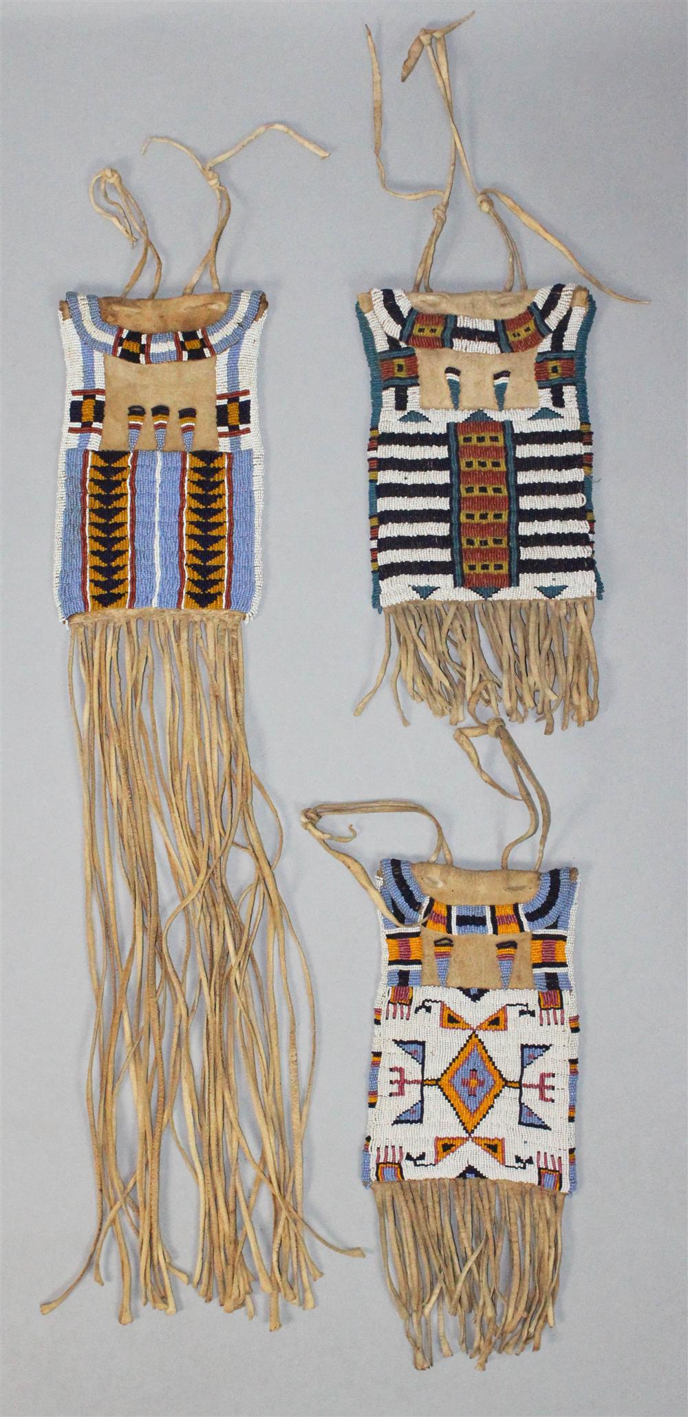 Appraisal: THREE PLAINS BEADED AND FRINGED HIDE DISPATCH BAGS Reservation period