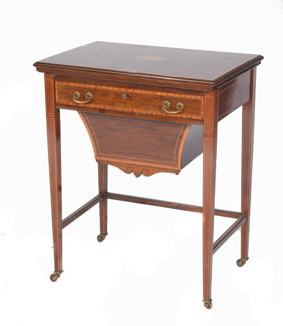 Appraisal: AN EDWARDIAN MAHOGANY AND SATINWOOD INLAID GAMES SEWING TABLE having