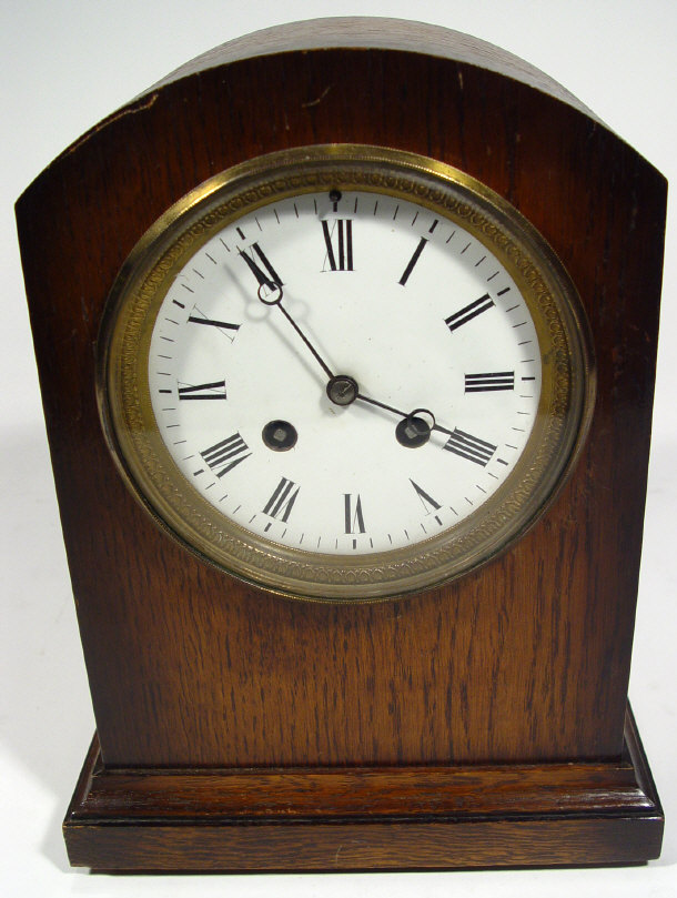 Appraisal: 's oak cased chiming mantel clock with enamelled dial striking