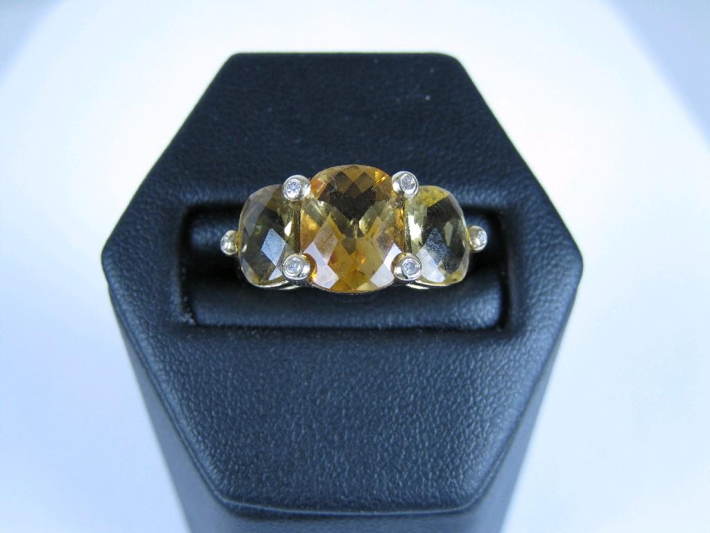 Appraisal: A Citrine three stone Ring set graduated mixed-cut stones with