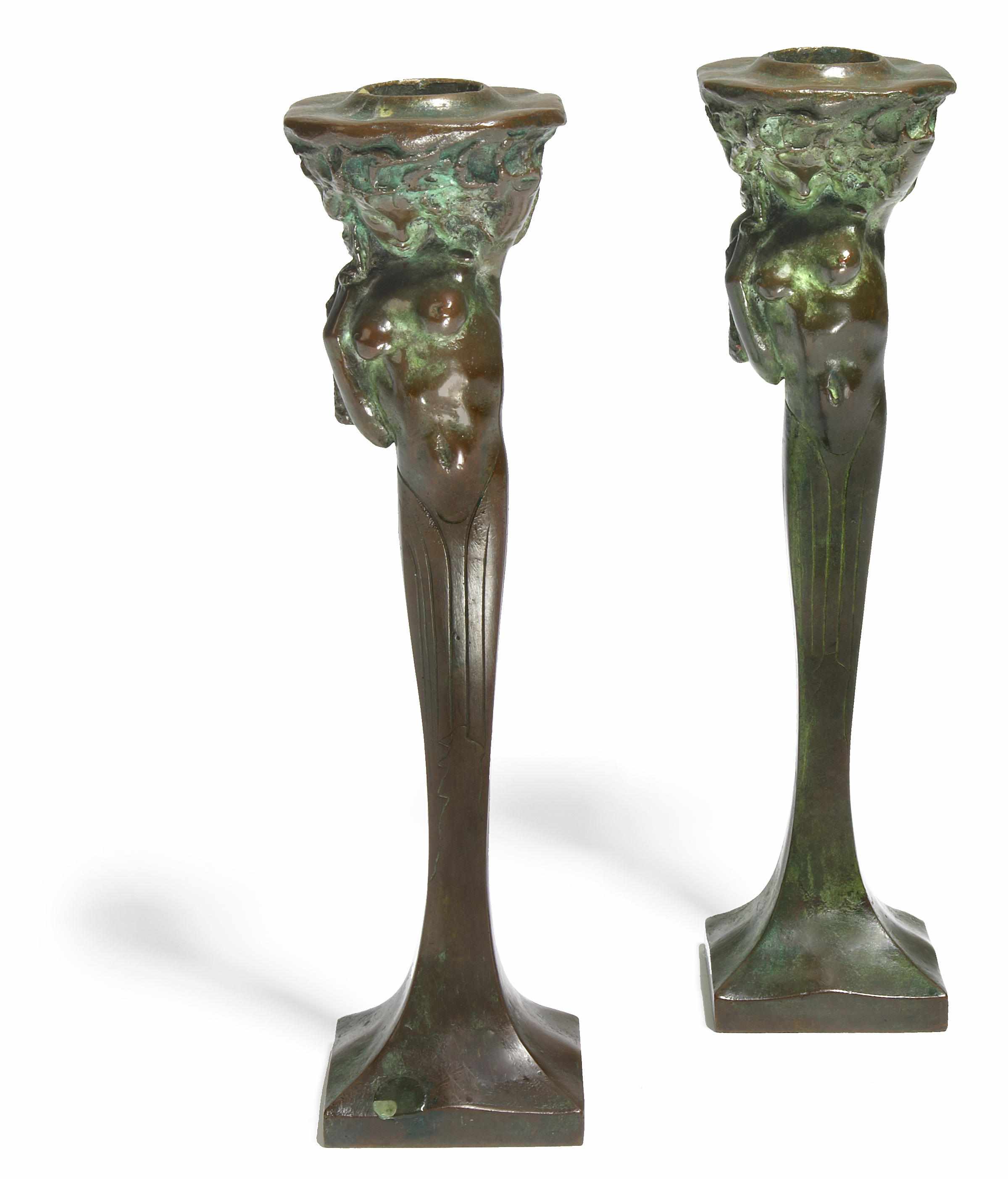 Appraisal: A pair of patinated bronze figural candlesticks signed M AZZI