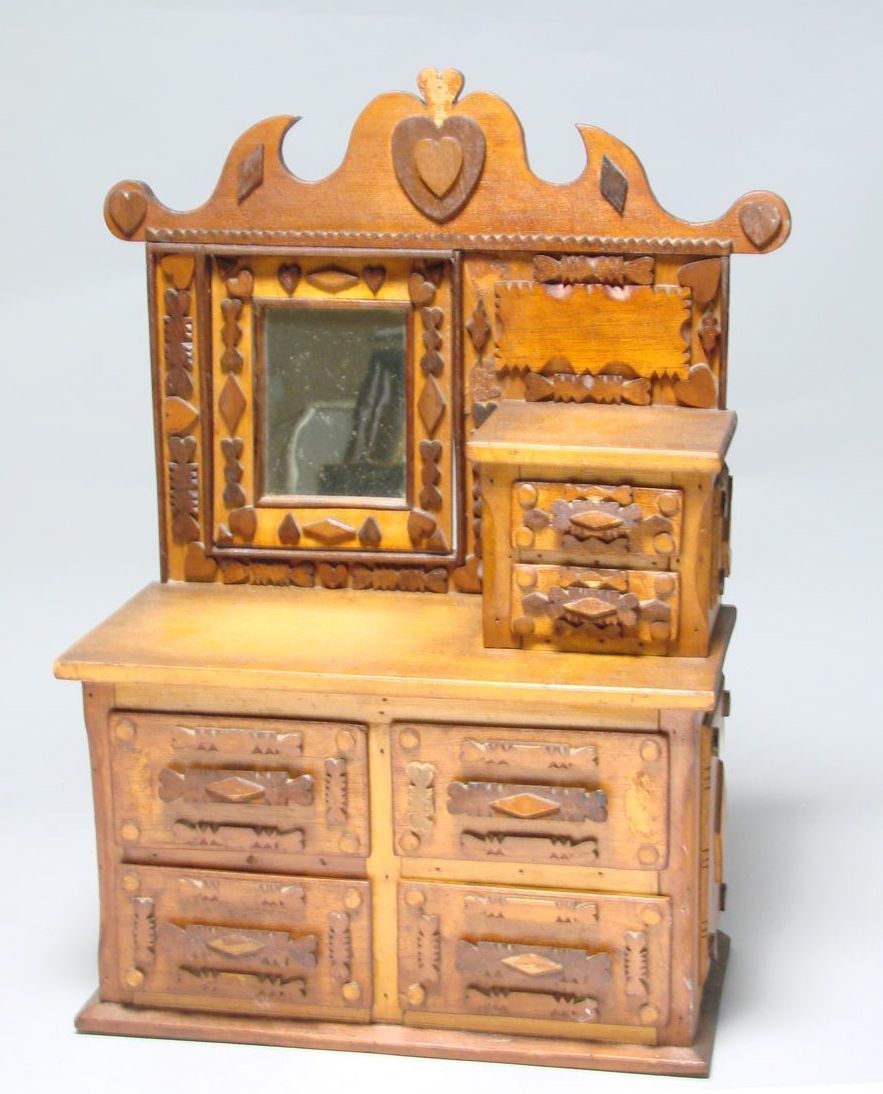 Appraisal: MINIATURE TRAMP ART DRESSER th CenturyWith carved and applied back