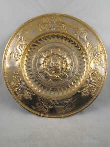 Appraisal: An embossed gilt metal charger with engraved dedication Captain William