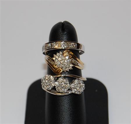 Appraisal: An ct white gold mounted diamond half-eternity ring channel set