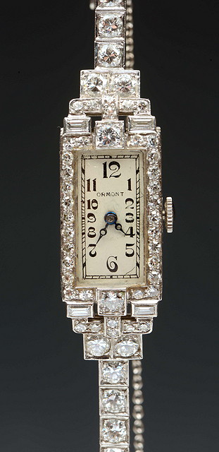 Appraisal: A DIAMOND SET LADIES COCKTAIL WATCH with rectangular white enamel