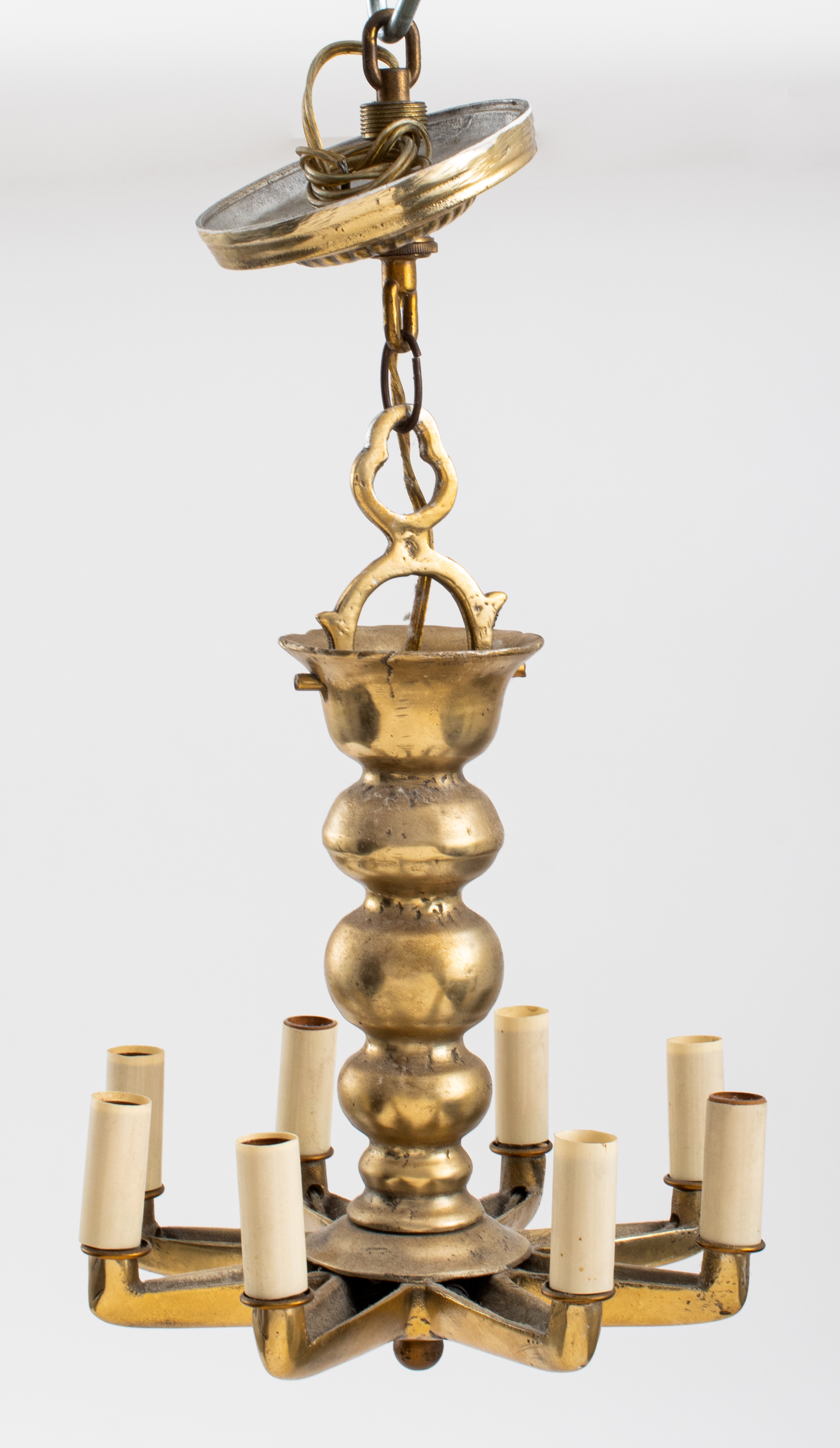 Appraisal: ART MODERNE BRASS EIGHT-LIGHT STAR-FORM CHANDELIER Art Moderne Brass eight-light