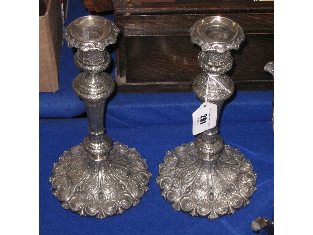 Appraisal: Pair of ornate embossed silver plated candle sticks