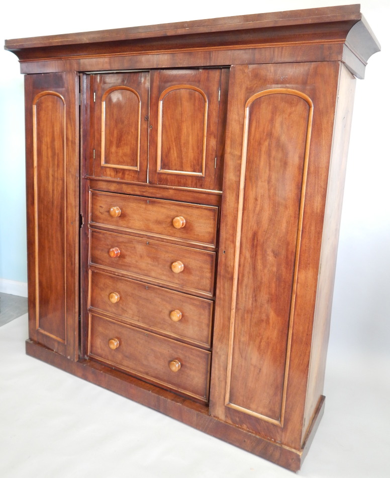 Appraisal: An early Victorian mahogany wardrobe with a moulded cornice above