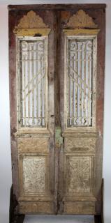 Appraisal: Rustic entry doors with iron panels Rustic entry doors with