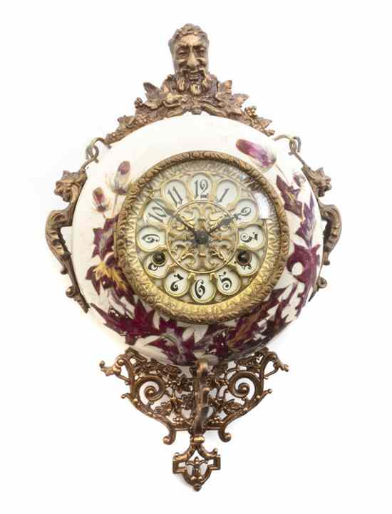 Appraisal: A Continental Ceramic and Gilt Metal Mounted Medallion Clock of