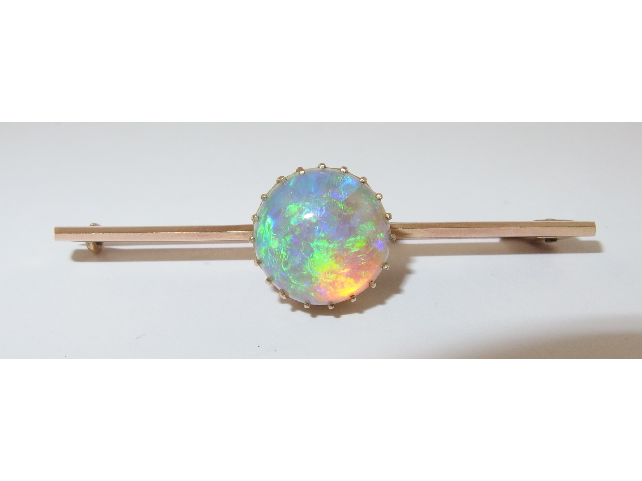 Appraisal: A ct gold opal bar broochset with a round cabouchon