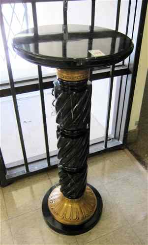 Appraisal: ORMOLU AND BLACK PORFIDO MARBLE PEDESTAL having a round marble