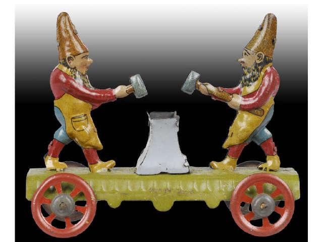 Appraisal: German Tin Gnomes Penny Toy Description Depicts gnomes with hammers