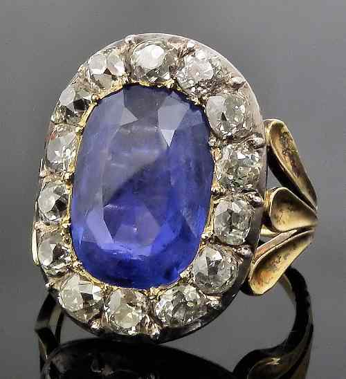 Appraisal: A Victorian gold and silvery coloured metal mounted sapphire and