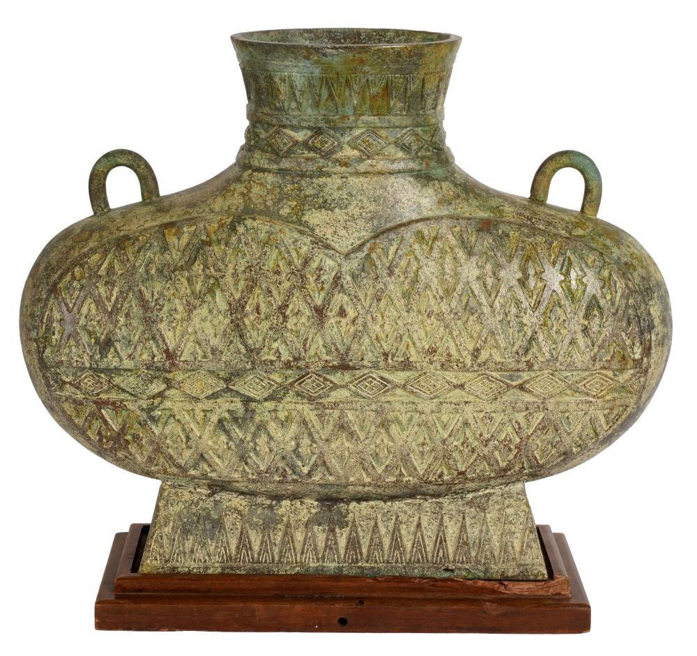 Appraisal: ARCHAIC BRONZE VASEdrilled with fitted wooden base Provenance The Estate